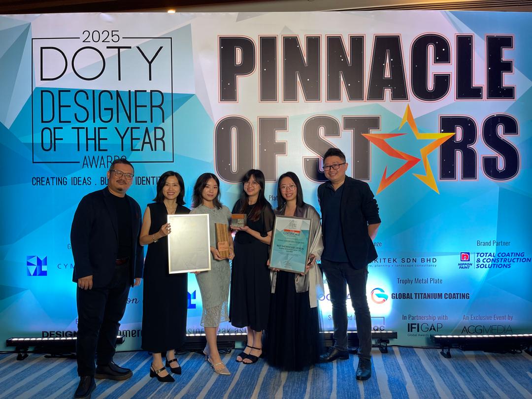 Interior design professionals posing for a photo at the Pinnacle of Stars award ceremony in Kuala Lumpur.
